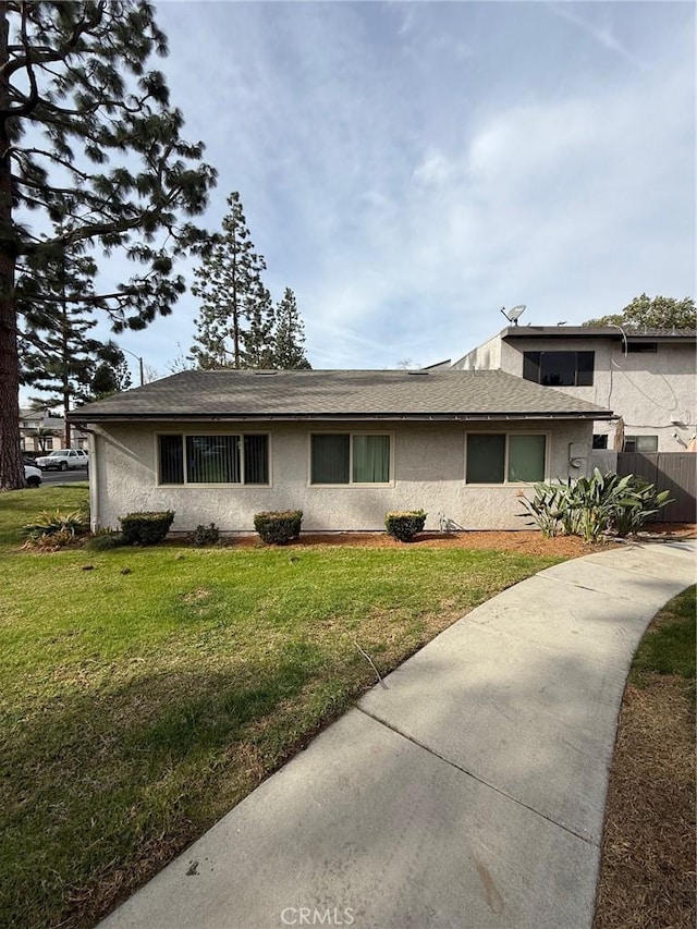 view of property exterior with a lawn