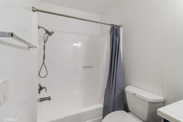 full bathroom featuring toilet, vanity, and shower / bathtub combination with curtain