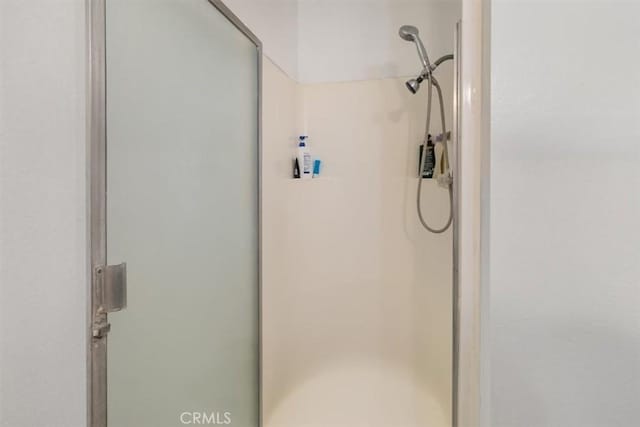 bathroom featuring an enclosed shower