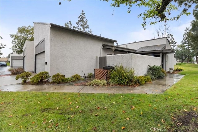 view of home's exterior with a yard