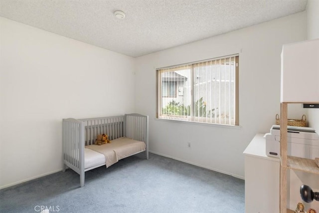 unfurnished bedroom featuring carpet and a textured ceiling