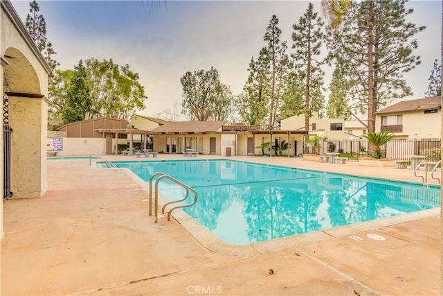 view of swimming pool with a patio area