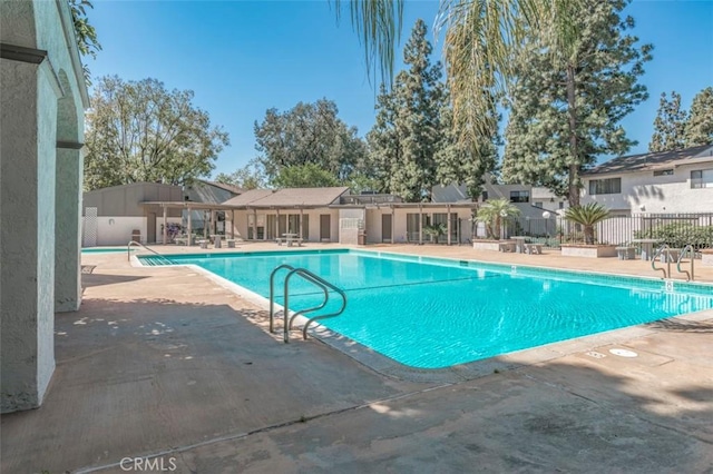 view of swimming pool with a patio