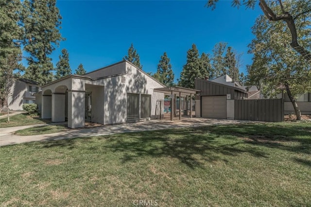 rear view of house featuring a yard and a carport