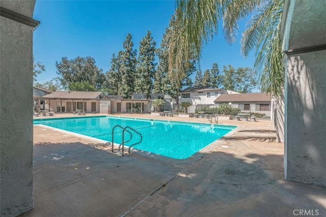 view of swimming pool featuring a patio