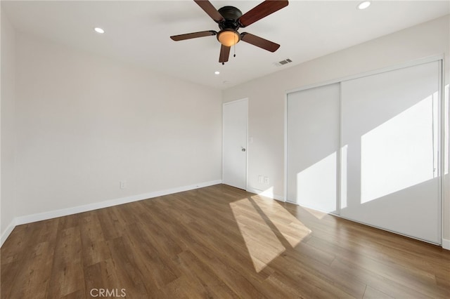 interior space with ceiling fan, a closet, and wood-type flooring