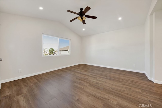 unfurnished room with ceiling fan, dark hardwood / wood-style flooring, and lofted ceiling