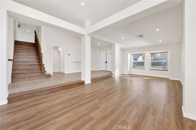 unfurnished living room featuring light hardwood / wood-style flooring