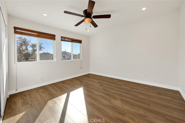 spare room featuring ceiling fan and wood-type flooring