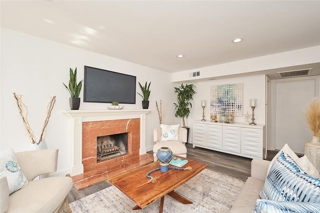 living room with a fireplace and hardwood / wood-style floors