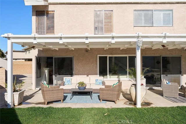 rear view of house featuring a patio area and outdoor lounge area