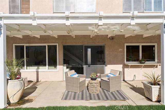 view of patio featuring an outdoor living space and a pergola