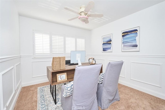 home office featuring ceiling fan and light colored carpet