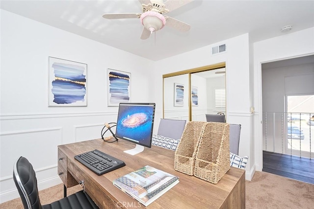 office with ceiling fan and carpet flooring