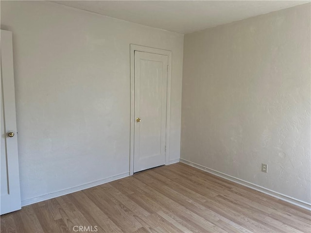 empty room with light wood-type flooring