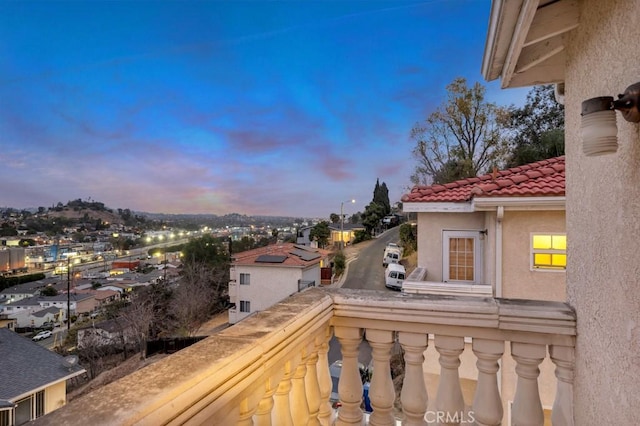 view of balcony at dusk