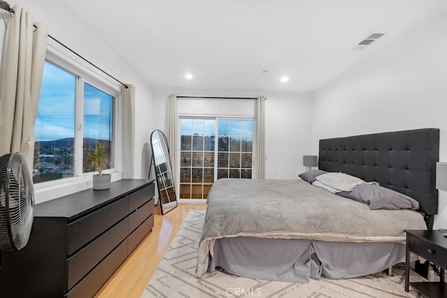 bedroom with light hardwood / wood-style flooring