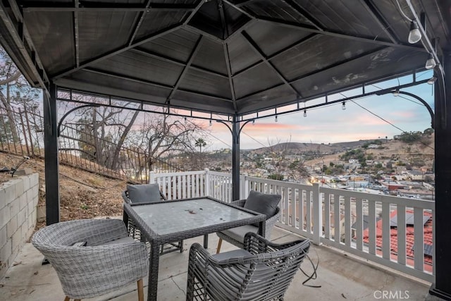 patio terrace at dusk with a gazebo