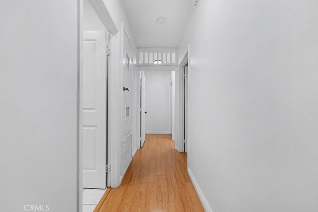 corridor featuring light hardwood / wood-style flooring