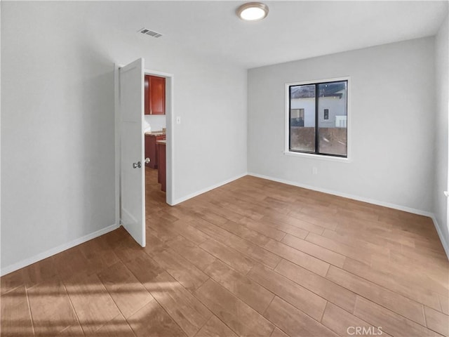 empty room featuring light hardwood / wood-style floors