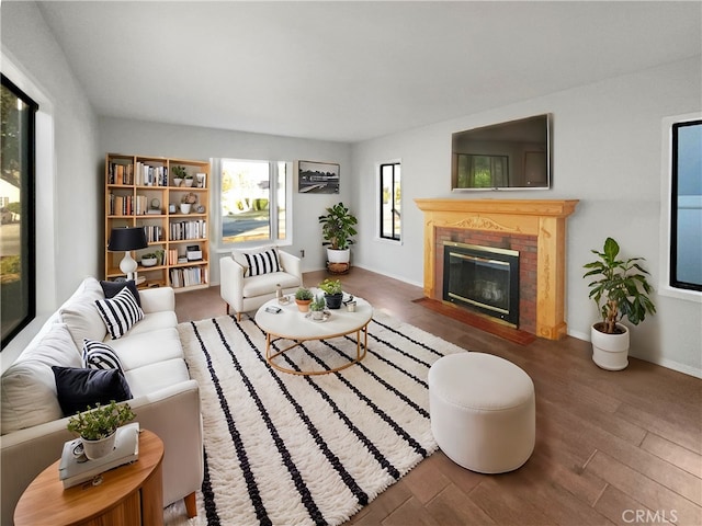 living room featuring a fireplace and dark hardwood / wood-style flooring