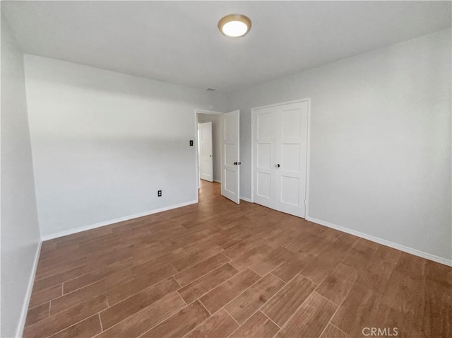 empty room with wood-type flooring