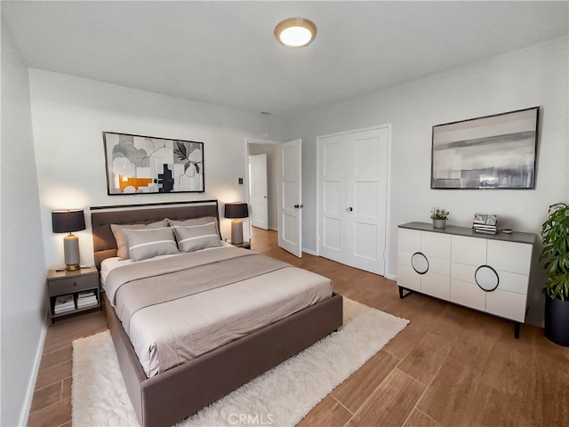 bedroom featuring hardwood / wood-style flooring