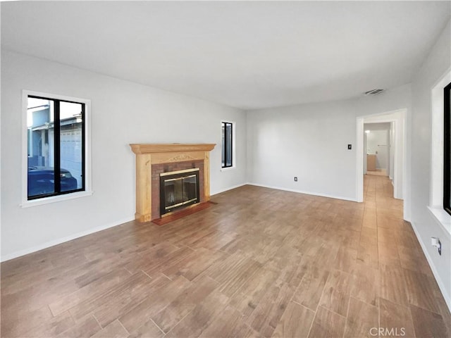 unfurnished living room featuring hardwood / wood-style flooring