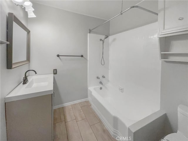 full bathroom with shower / tub combination, vanity, and toilet