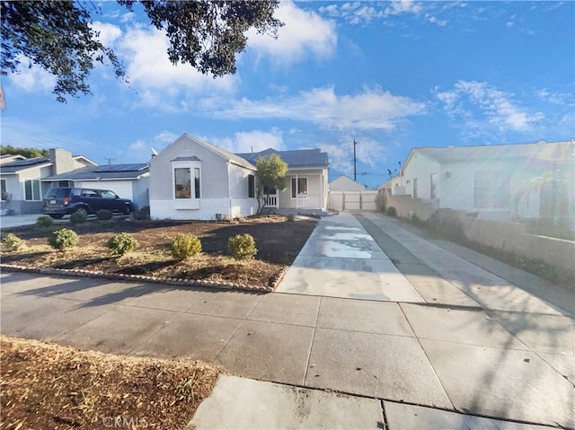 view of front of property with solar panels