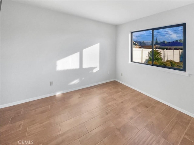 spare room featuring light hardwood / wood-style floors