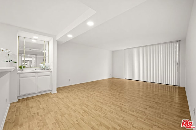 unfurnished living room featuring light hardwood / wood-style floors