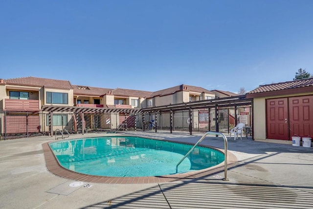 view of swimming pool with a patio