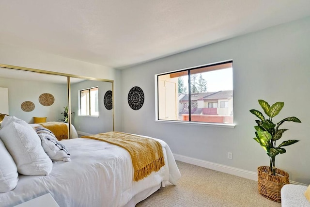 carpeted bedroom with a closet