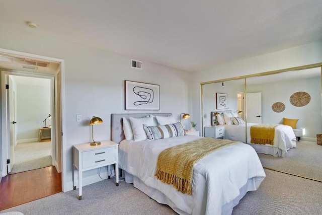 carpeted bedroom with a closet