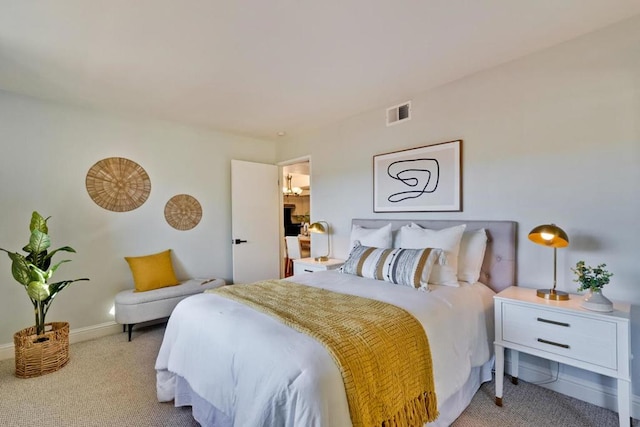 bedroom with light colored carpet