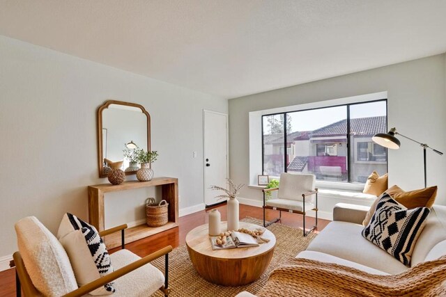 living area with hardwood / wood-style flooring