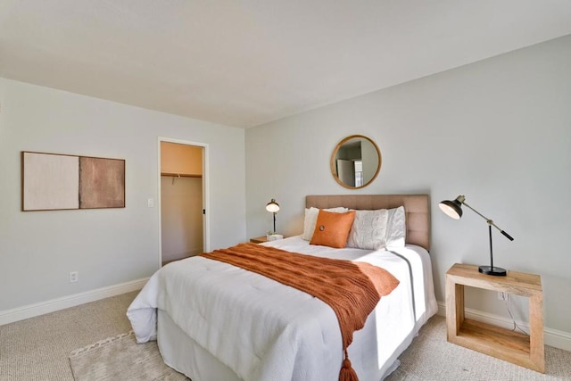 carpeted bedroom featuring a spacious closet