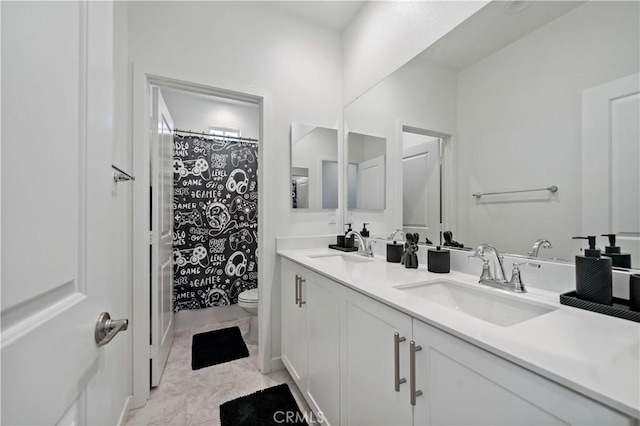 full bathroom with vanity, shower / tub combo, and toilet