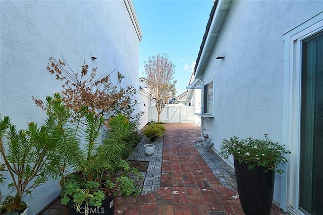 view of side of home with a patio