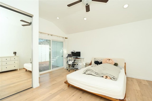 bedroom featuring ceiling fan, access to exterior, light hardwood / wood-style flooring, and lofted ceiling