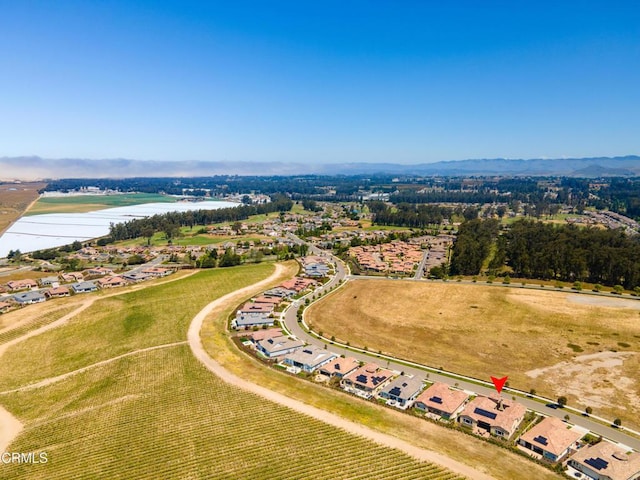 birds eye view of property featuring a water view and a rural view