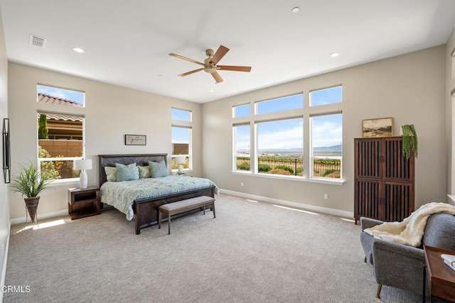 bedroom featuring ceiling fan and light colored carpet