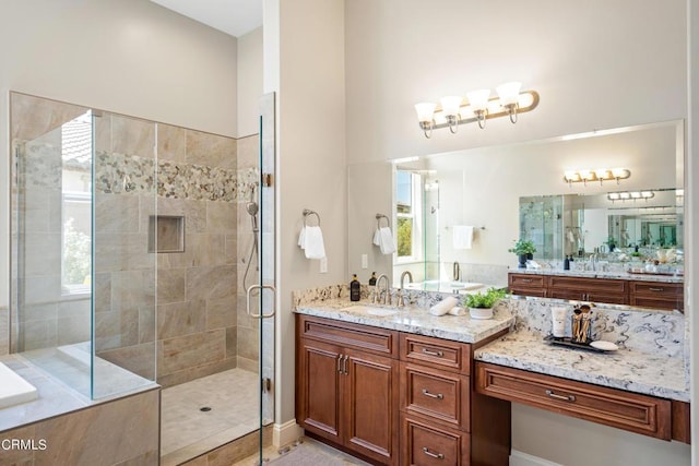 bathroom with separate shower and tub and vanity