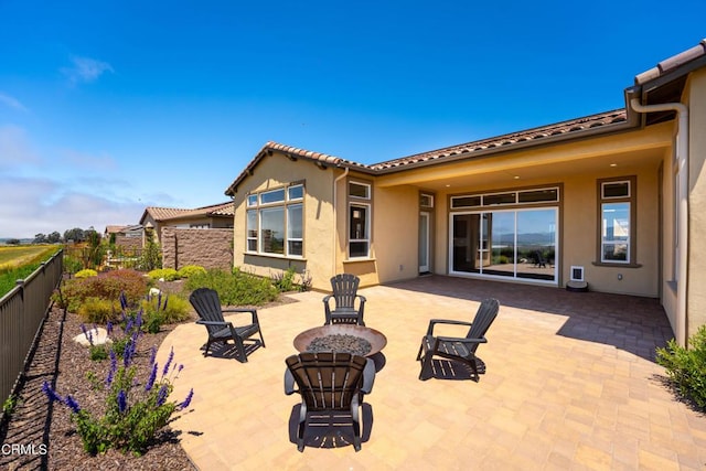 view of patio featuring an outdoor fire pit