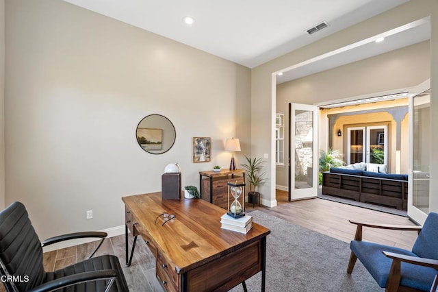 office featuring light wood-type flooring and french doors