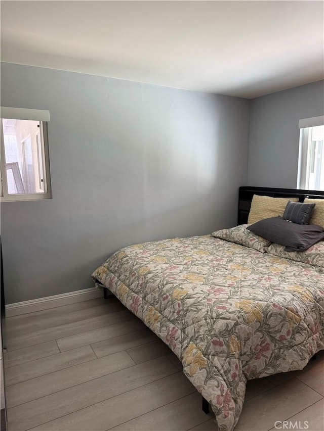 bedroom featuring light wood-type flooring