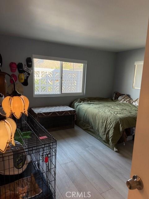 bedroom with hardwood / wood-style flooring