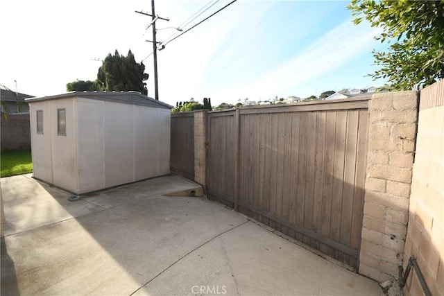 view of patio with a shed