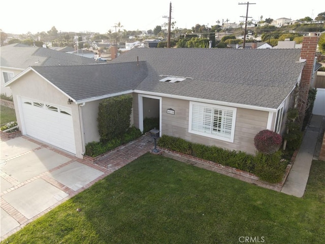 ranch-style home featuring a front lawn and a garage